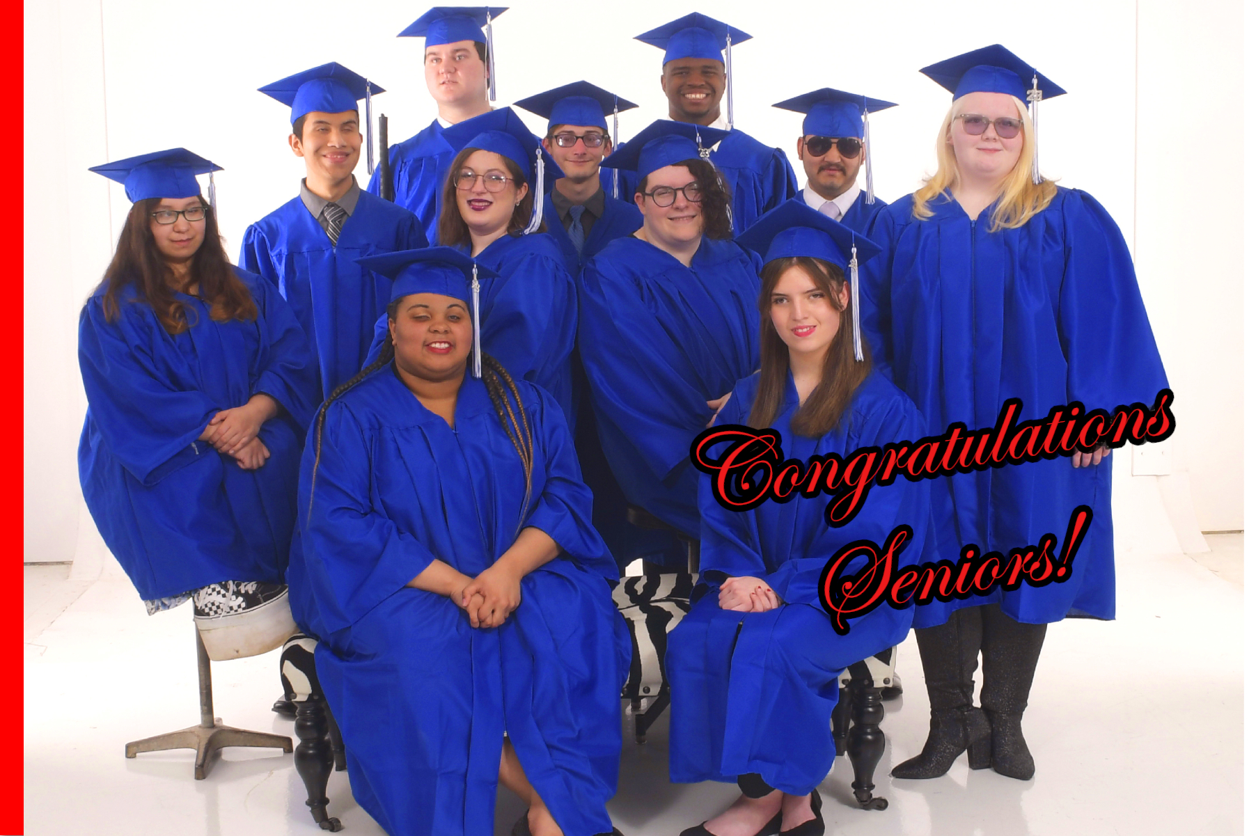 Group of senior students in blue cap in gown standing together